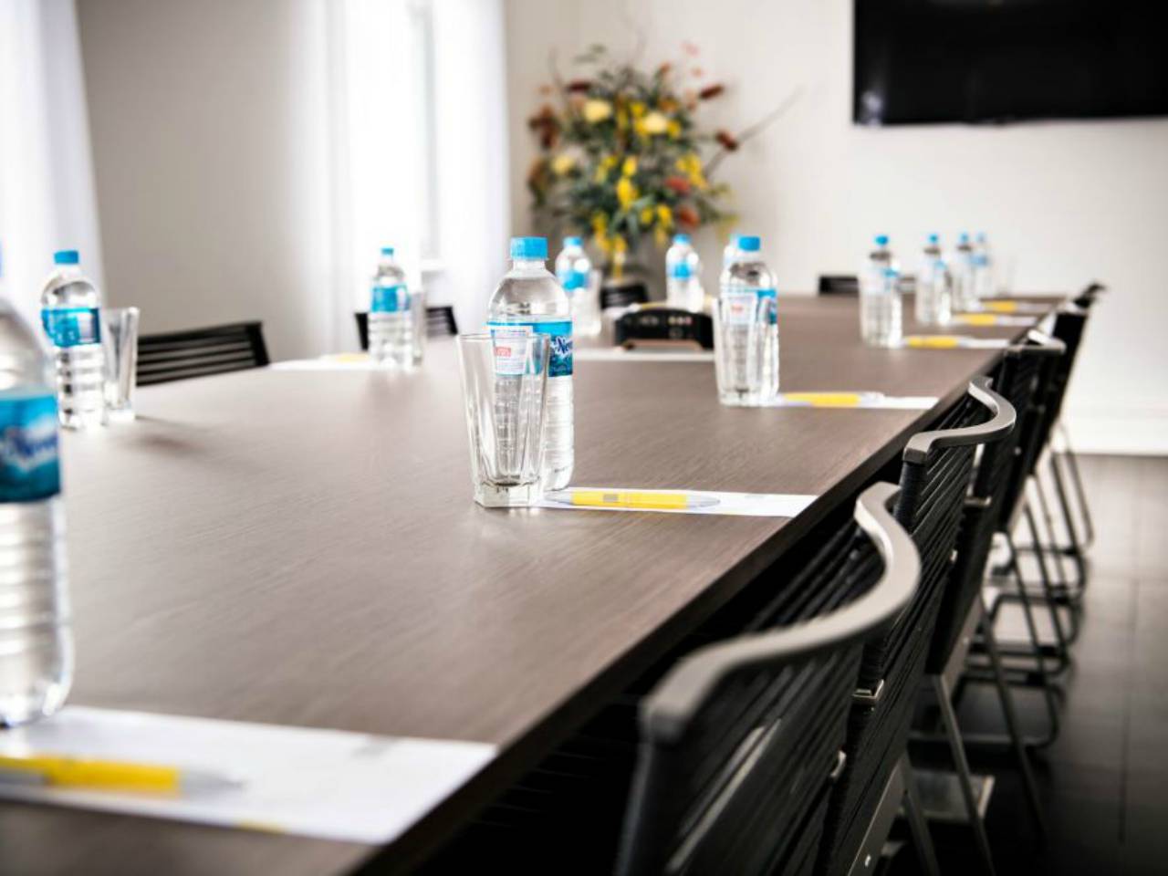 Meeting Table With Bottles Of Water, Ready For A Team Meeting.