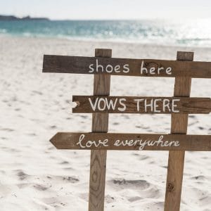 A Sign That Says Shoes Here, Vows There, Love Everywhere.