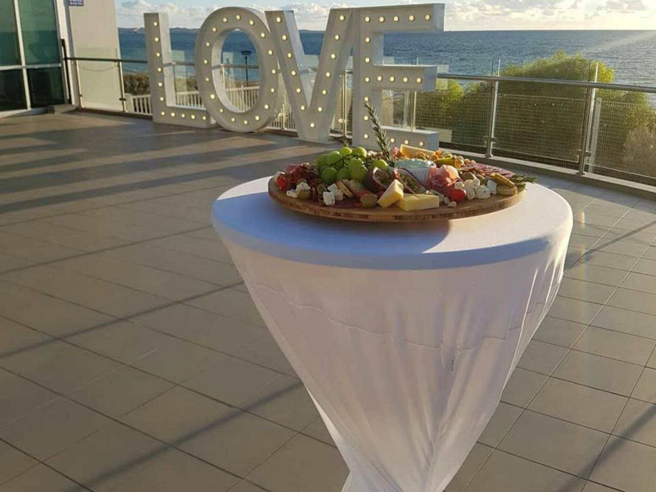 A Food Platter With A View Of The Ocean.
