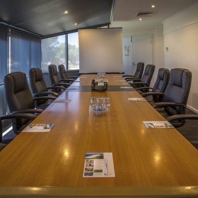 Coporate Meeting Room With Grey Chairs.