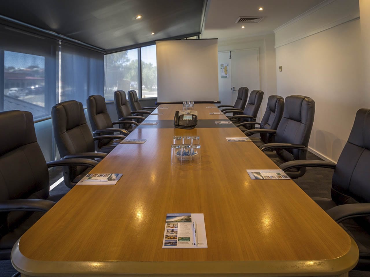 Coporate Meeting Room With Grey Chairs.