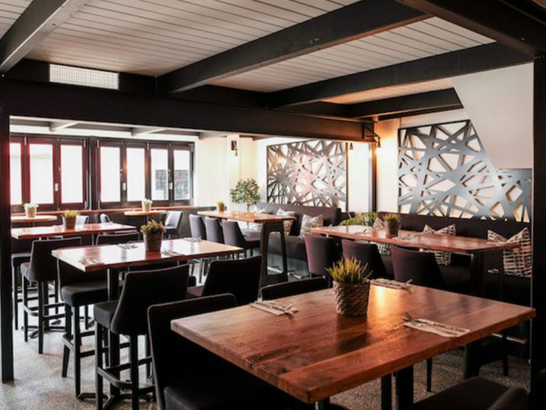 Inside the Restaurant with Chairs and Tables and centerpieces for venue hire