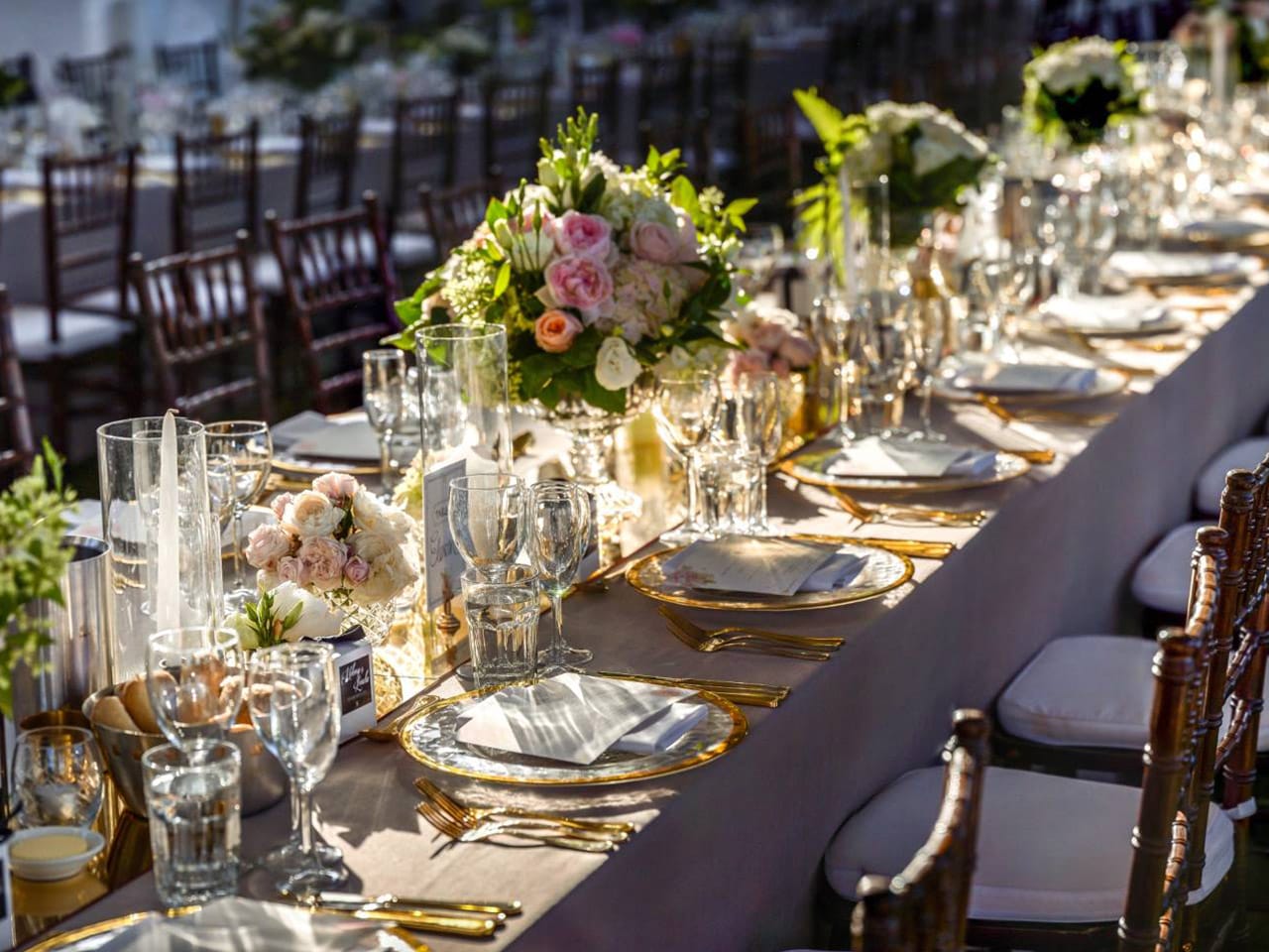 Long Table Wedding Setup With Flower Centerpieces And Decors