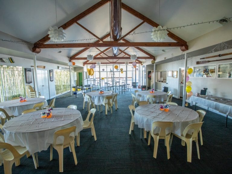 Casual Function Set Up With Round Tables And Chairs At Swan River Rowing Club Riverside Venue