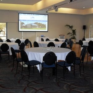 Banquet Style Setup With Projection Screen Inside The Function Room