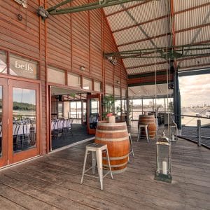 Perth Function Venue Balcony With Wine Casks As Table With Chairs And River Views