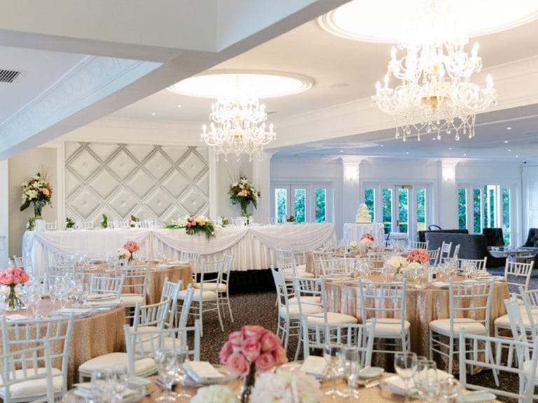 Long Table And Banquet Style Setup Inside The Function Room With Chandeliers