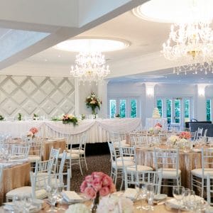 Long Table And Banquet Style Setup Inside The Function Room With Chandeliers