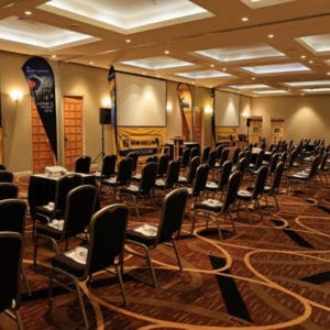 Chairs in Theatre Style Setup Inside The Swan Valley Function Room With 3 Projection Screens