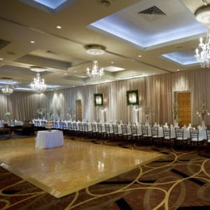 Swan Valley Venue With A Very Long Table On The Sides Of The Function Room With A Dance Floor And Chandeliers