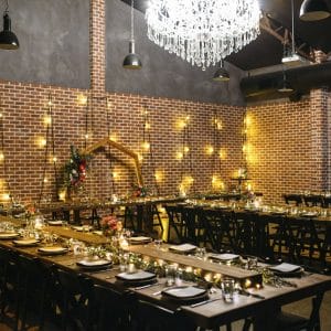 Full room setting with long tables and wall light decorations