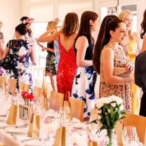 Guests Enjoying Inside The Function Room With A Long Table