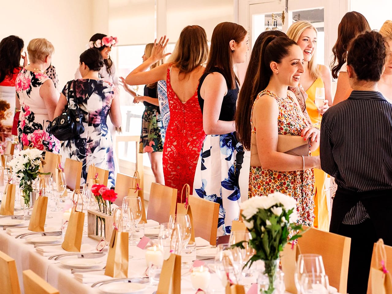 Guests Enjoying Inside The Function Room With A Long Table