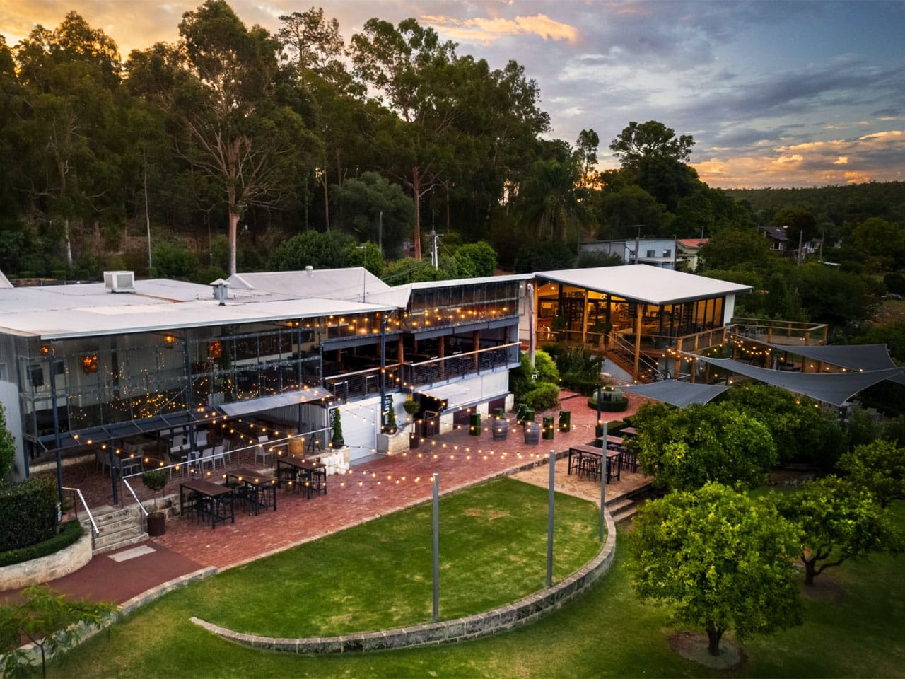 Aerial view of Core Cider House at dusk with lights