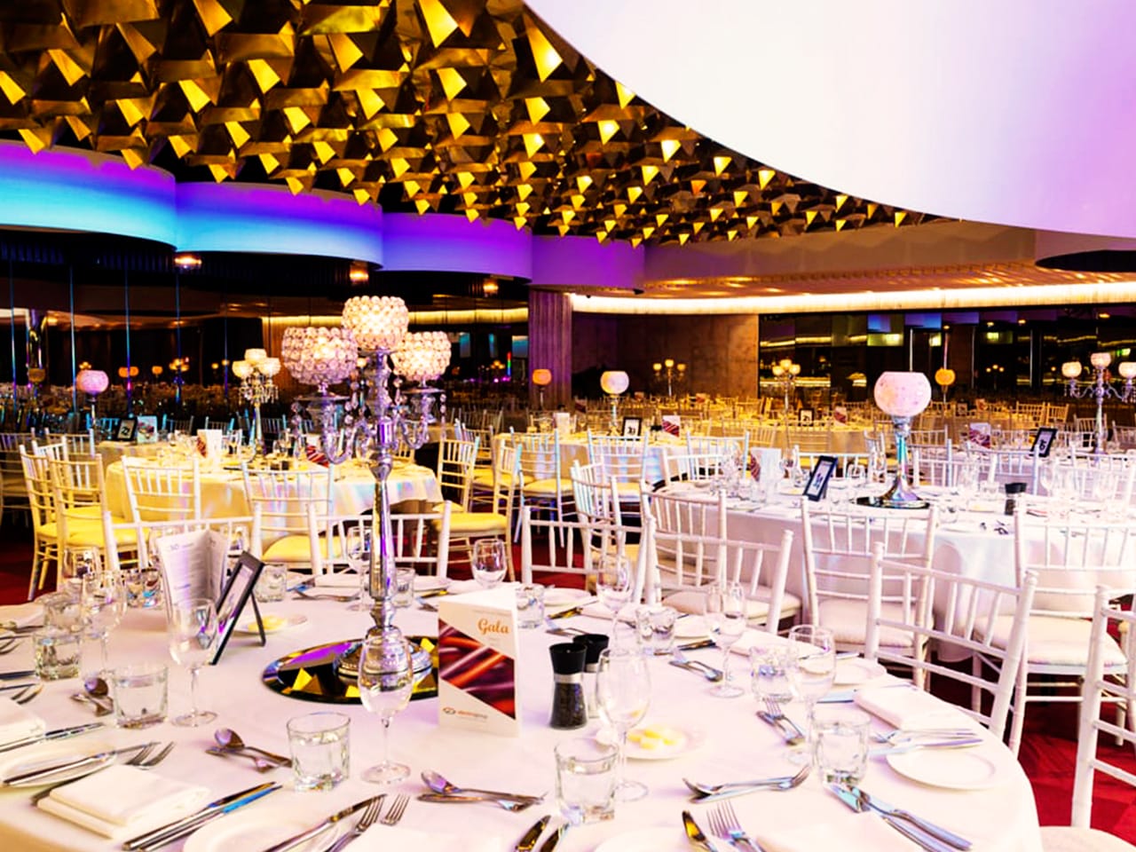 Round white tables set for an event