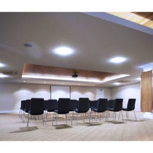 Inside The Function Room With Chairs, Projector And A Projection Screen