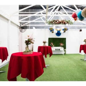 Open space function area with round red tables