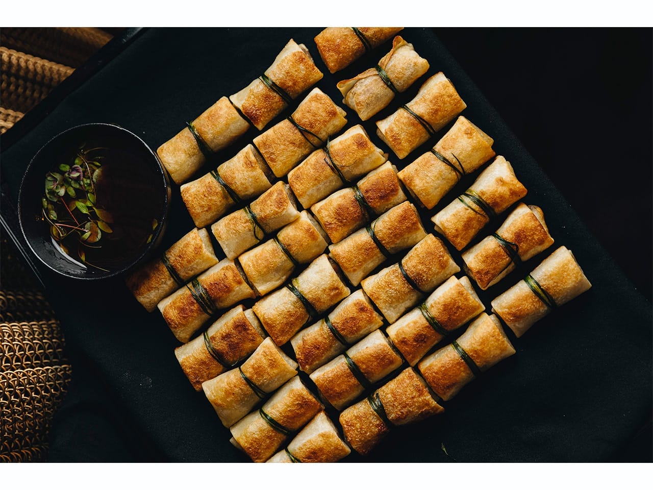 A platter of crispy fried spring rolls