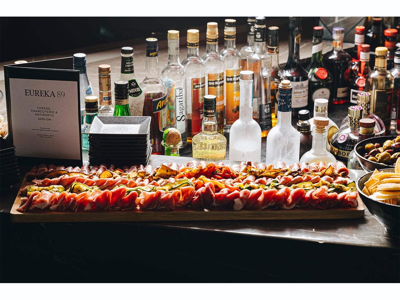 Gourmet food display with wine and spirits